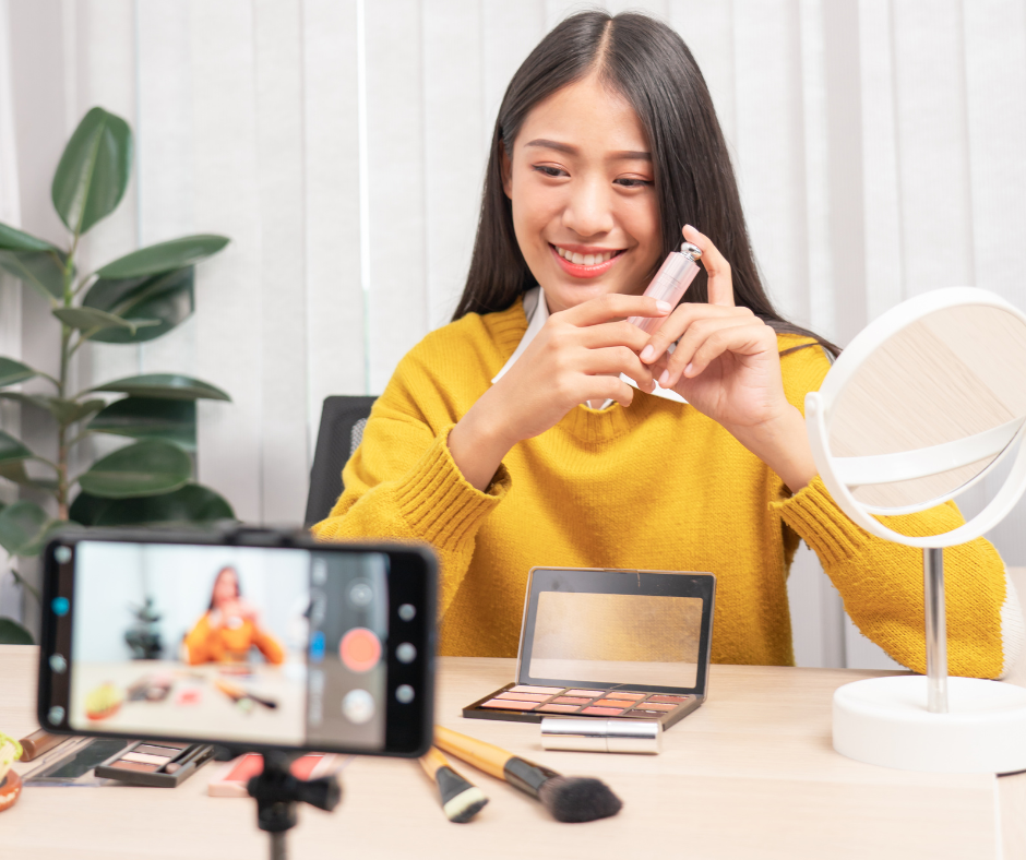 Woman UGC creator holding up product to display for video.